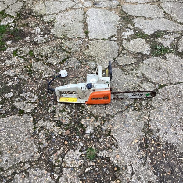 Vintage Stihl 028 electric chainsaw for garden use.