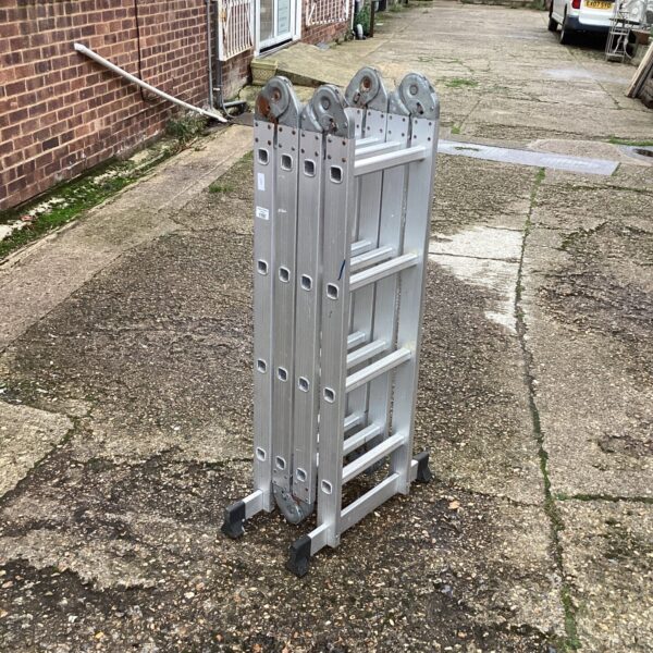 Portable aluminium folding ladder in outdoor setting.