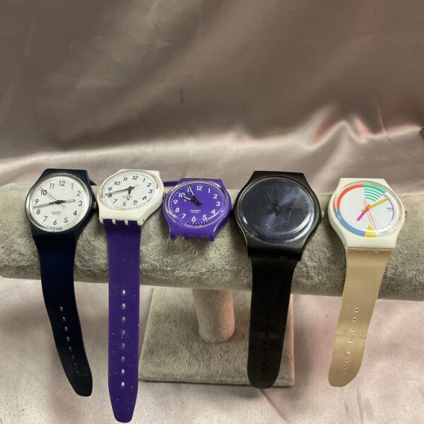 Group of five colourful vintage Swatch watches.