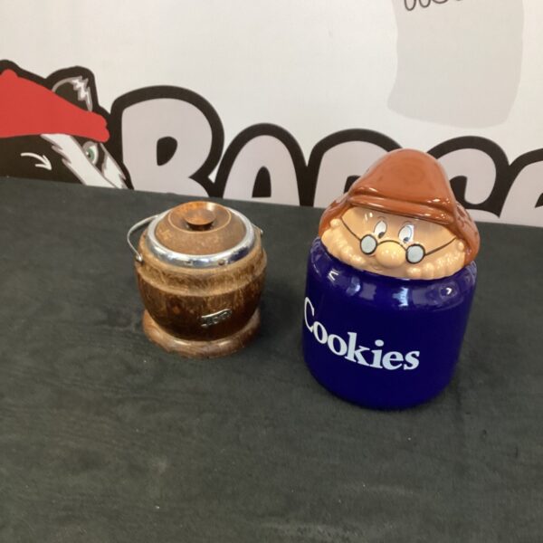 Vintage wooden tea caddy and cookie jar set for kitchen storage.