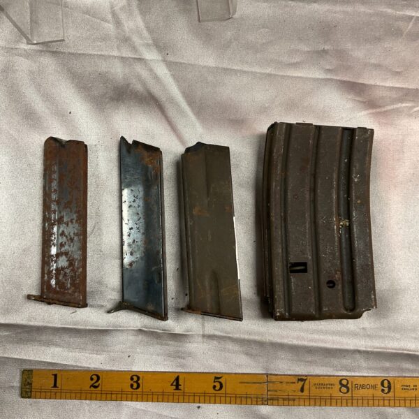 Lot of four vintage gun magazines with corrosion.