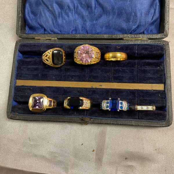 Assorted costume jewellery rings displayed as a lot for sale.