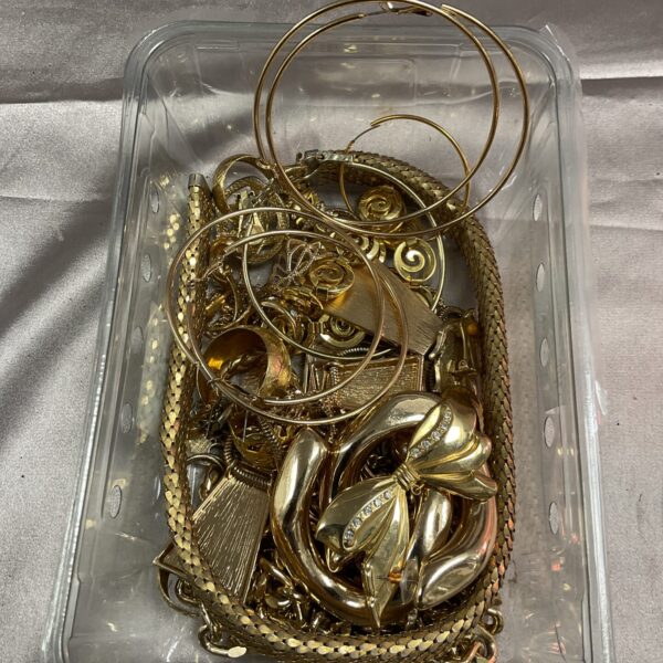 Assorted gold plate jewellery lot with necklaces and bracelets.