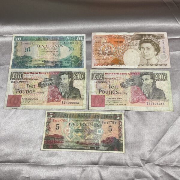 Lot of vintage British banknotes including £10 and £5 notes.