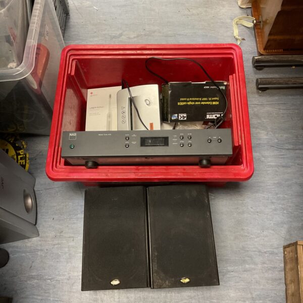 NAD Stereo Tuner 412 inside a red storage box with other items.