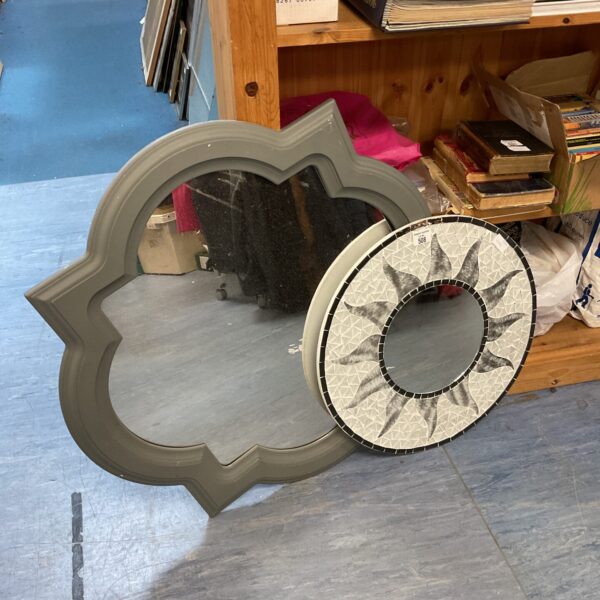 Vintage mosaic sun mirror with sunburst design for wall decor.