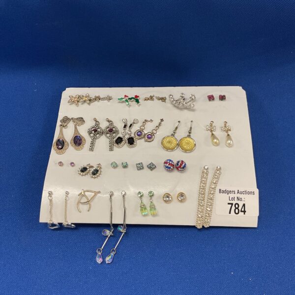 Assorted earring collection with various styles and colours.