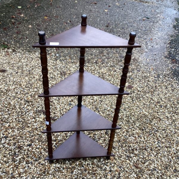 Vintage mahogany corner unit with four tiers for display.
