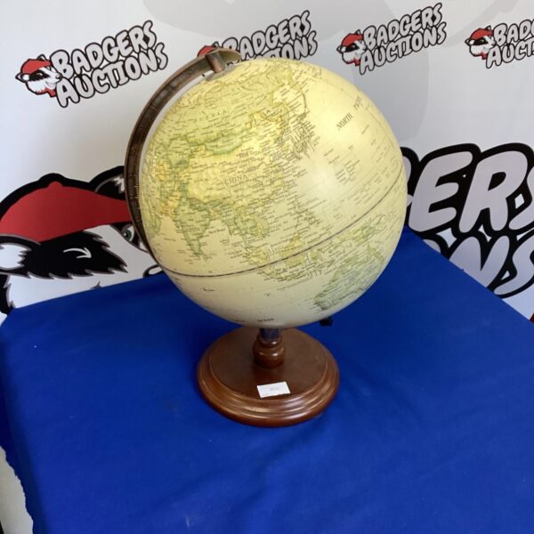 Antique globe on a wooden base, detailed geographical markings.