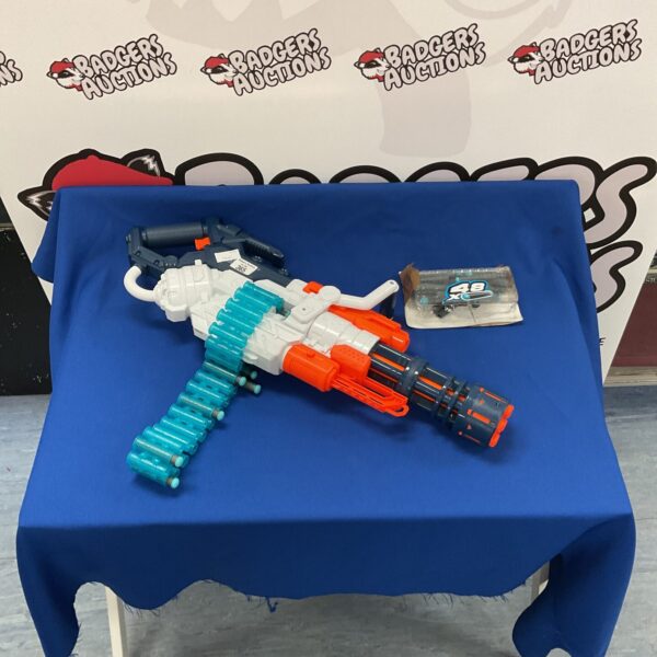 Large Nerf gun with extra ammunition for active play.