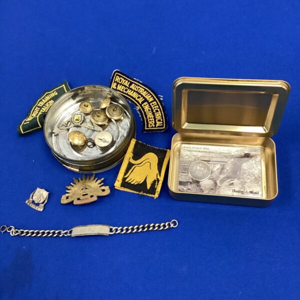 Vintage Australian army sweetheart tin with badges and buttons.