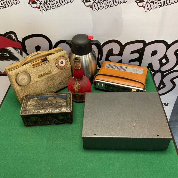 Vintage radio lot with Grand Marnier bottle on display.