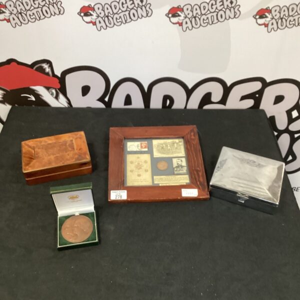 Vintage collectible lot featuring a wooden box and medal.