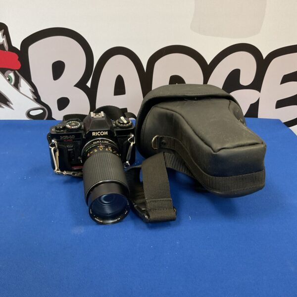Vintage Ricoh KR-10 Super 35mm film camera with strap.