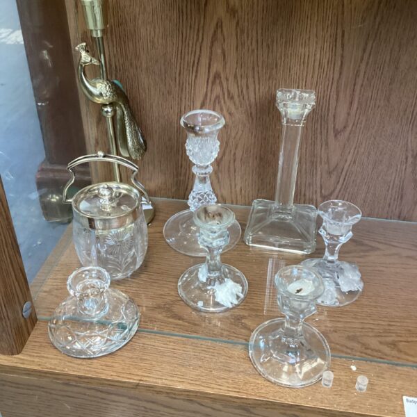 Selection of vintage clear glass candle holders for table decor.