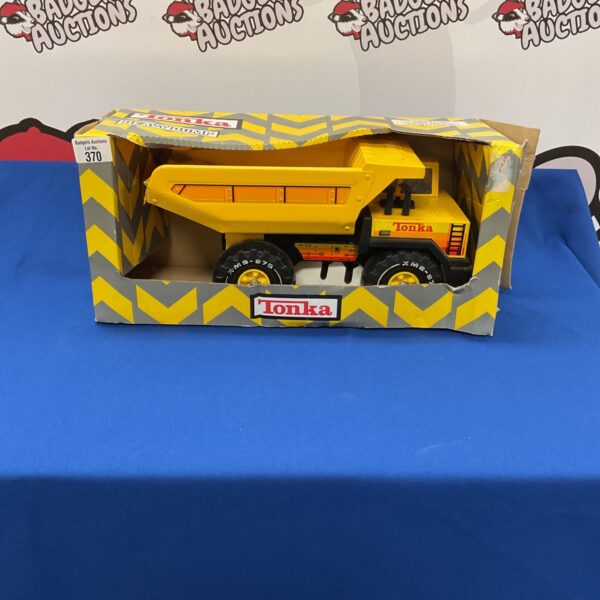 Vintage Tonka dump truck in original box, collectible metal toy.