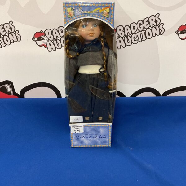 Unopened Bonecas porcelain collector doll in original packaging.