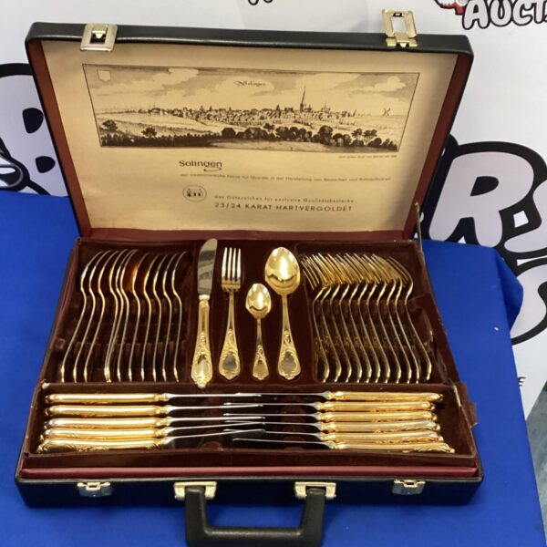 Vintage Solingen gold plated cutlery set in a protective case.