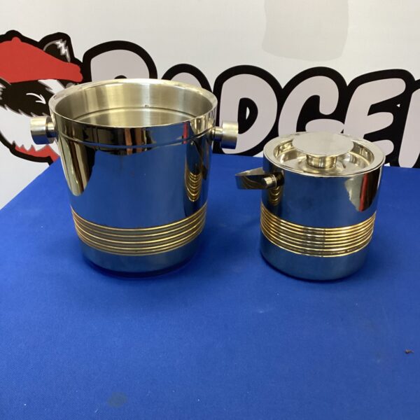 Polished stainless steel champagne and ice buckets, matching pair.