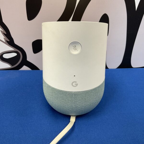 Compact Google Nest Mini smart speaker on a patterned background.