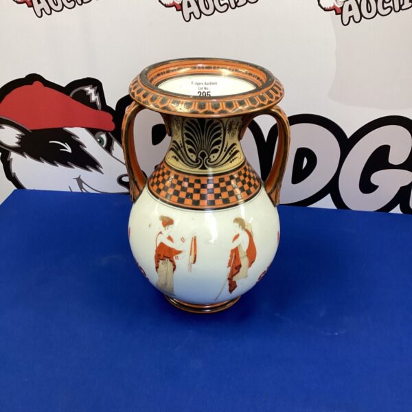 Detailed Greek style porcelain vase with red and black patterns.