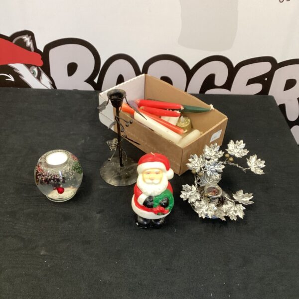 Festive Christmas table decorations featuring a snow globe and Santa.