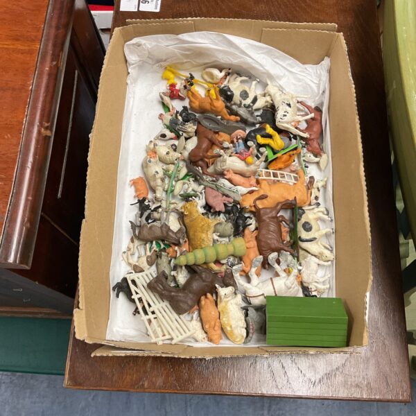 Vintage Britains farm animal figurines in a box.