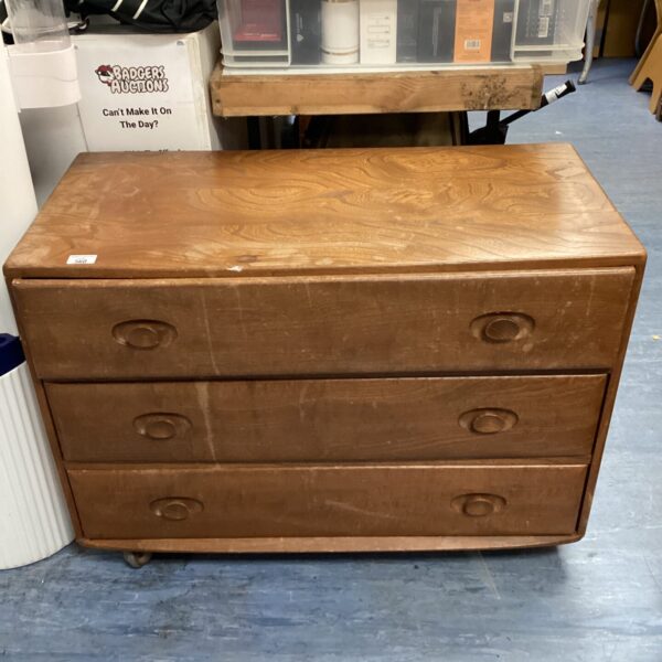 Vintage Ercol three-drawer cabinet with bowed top for restoration.