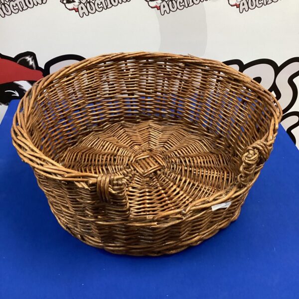 Handwoven wicker pet bed for small animals.