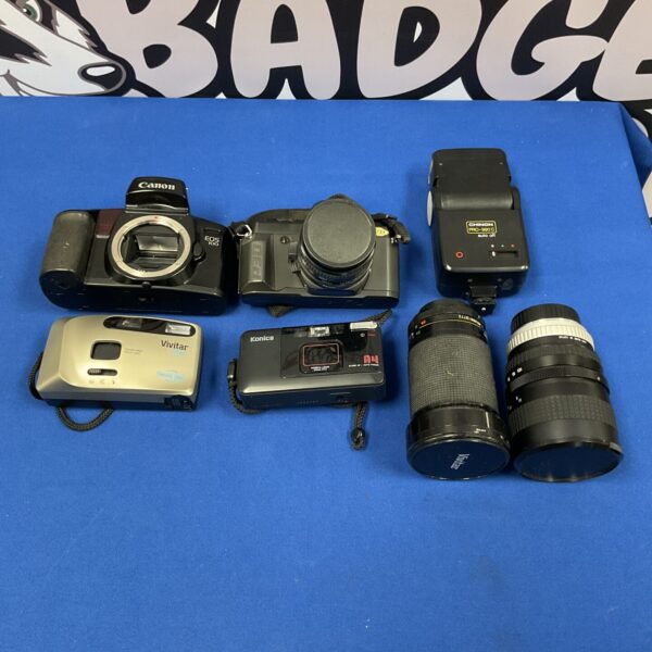 Vintage Canon EOS 100 and Pentax P30N film cameras in a lot.