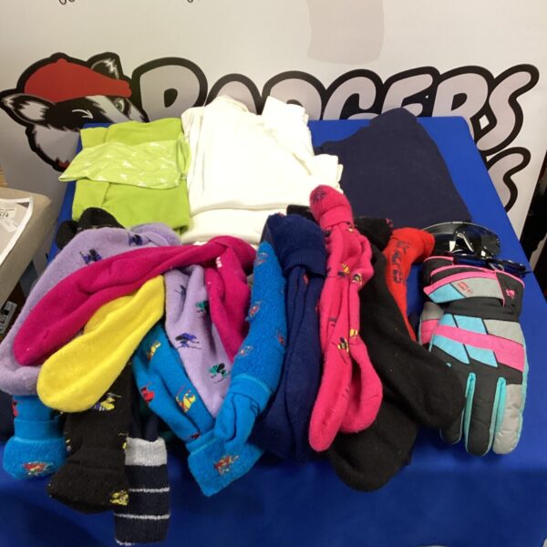 Colourful ski clothing bundle including socks, gloves and tops.