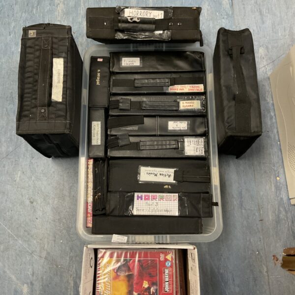 Large DVD movie collection lot with wallets and box sets.