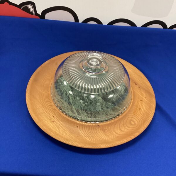 Vintage marble inlay food dome on wooden base.