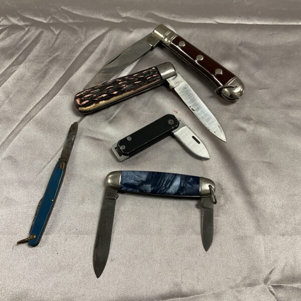 Lot of five vintage pocket knives with varied handles.