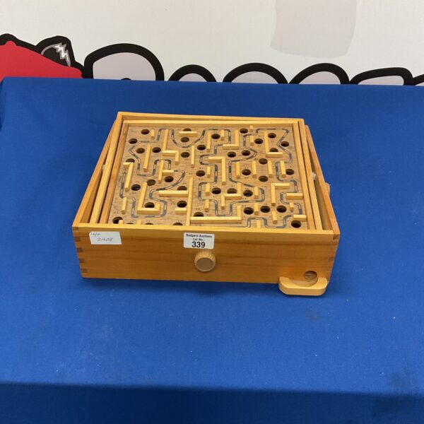 Vintage wooden puzzle maze, a classic retro game for collectors.
