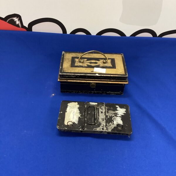 Vintage metal money box, antique savings bank, collectible tin.