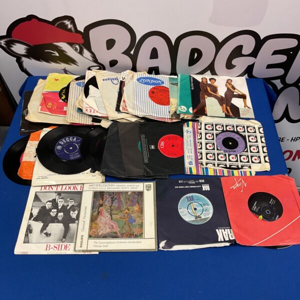 Vintage 7” vinyl record collection featuring Kim Wilde and B-Side.
