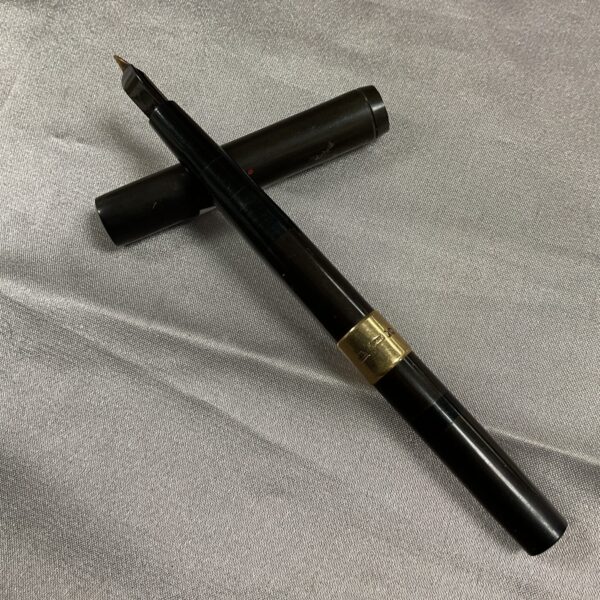 Vintage Waterman pen with 9ct gold cuff, classic writing instrument.