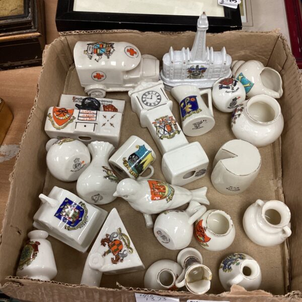 Vintage crested ware collection featuring porcelain jugs and vases.