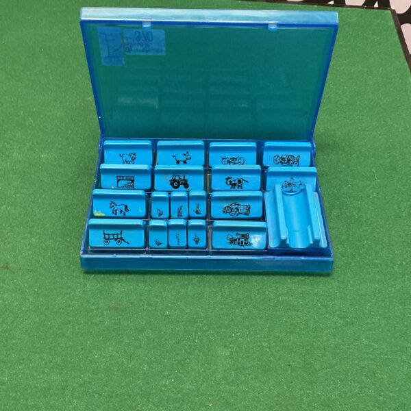 Vintage Early Learning Centre stamp tray with colourful rubber stamps.