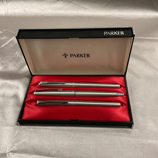 Silver Parker pen set with two fountain pens and one ballpoint pen.