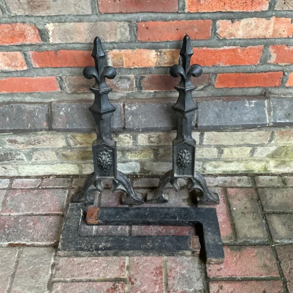 Antique fleur de lis fire dogs, vintage cast iron andirons.
