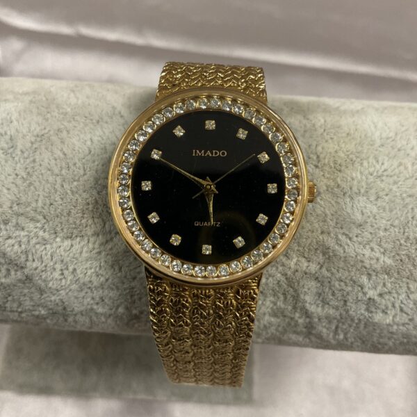 Vintage Imado ladies’ quartz wristwatch with gold tone band.