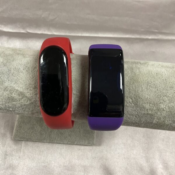 Red fitness watch activity tracker on a white background.