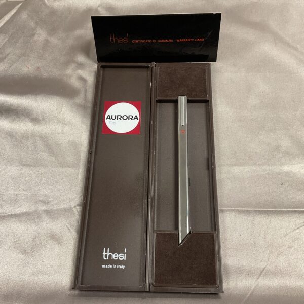 Silver Aurora Thesi designer pen presented with its warranty card.