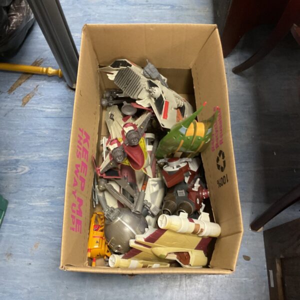 Vintage Star Wars spaceship toy lot with various plastic ships.