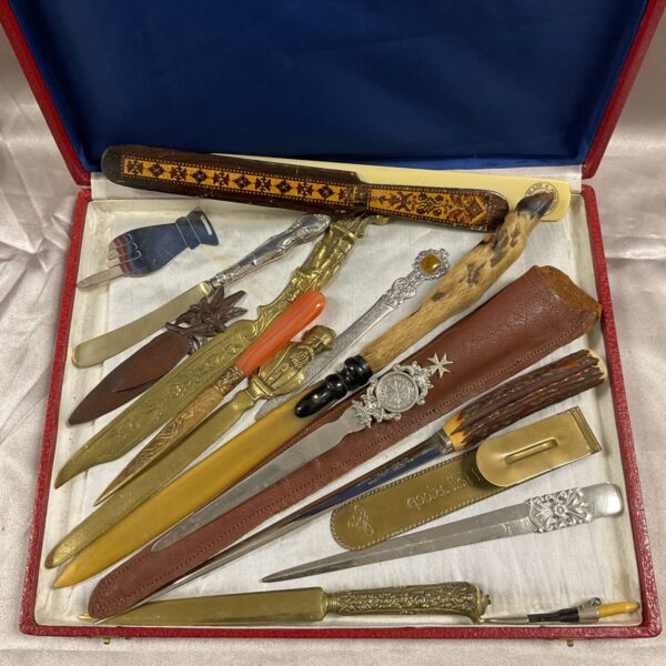 Vintage letter opener collection with silver and ornate handles.