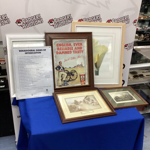 Vintage framed Bombardier poster and mixed prints lot for collectors.