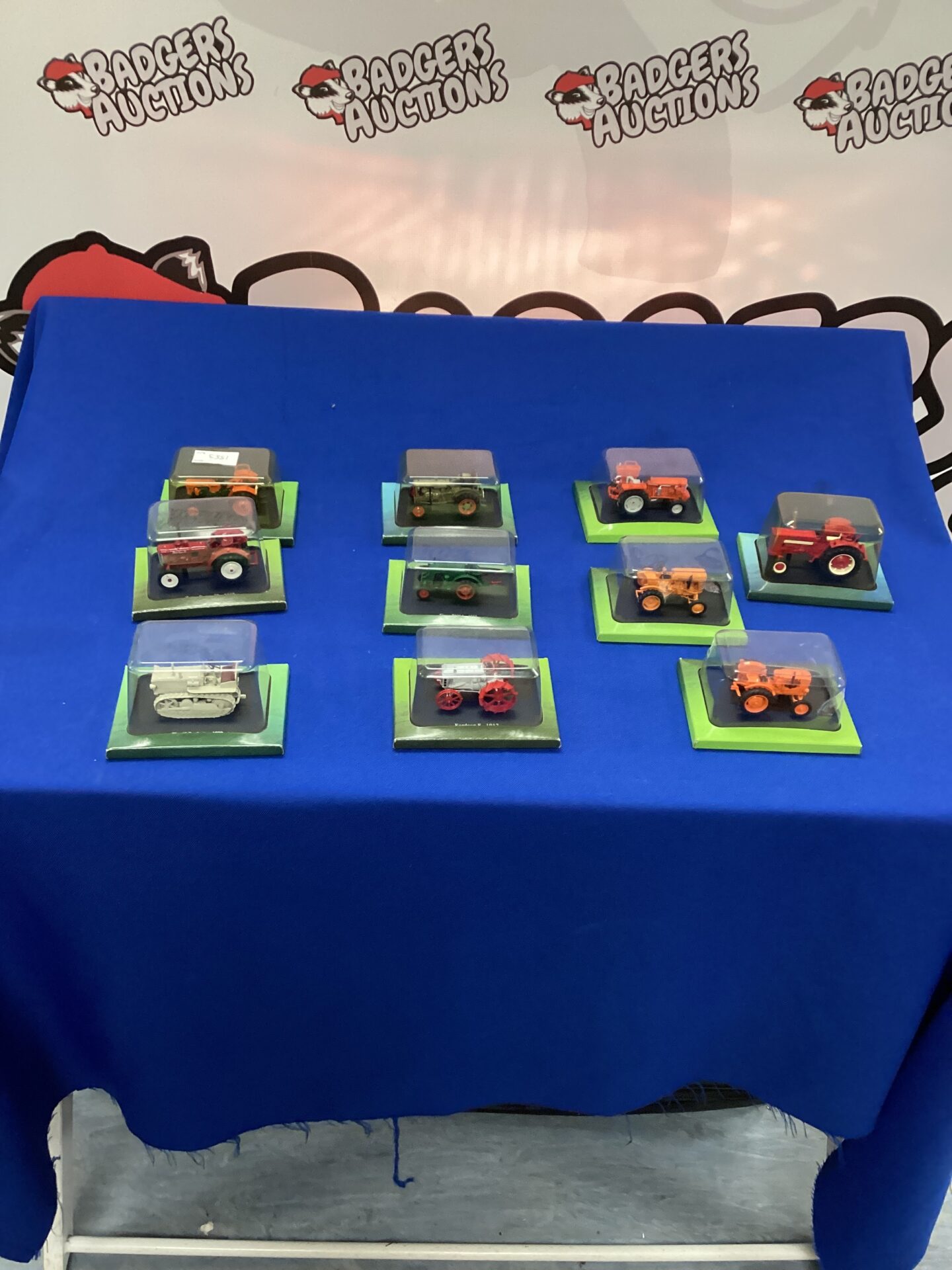 354 Selection of diecast model tractors in display boxes