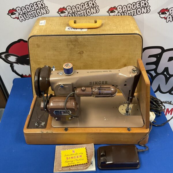 Vintage Singer 201 sewing machine in original box.